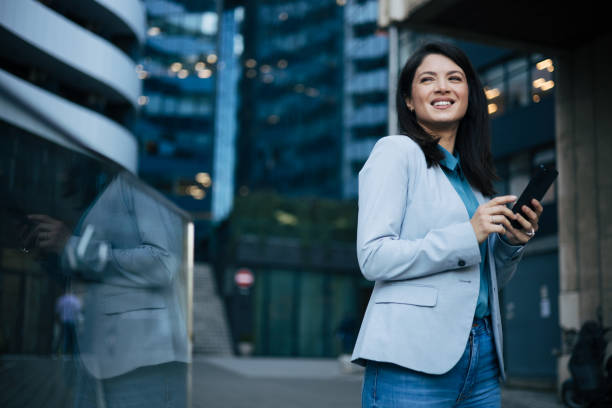 istock Young businesswoman using cell phone 1889339724