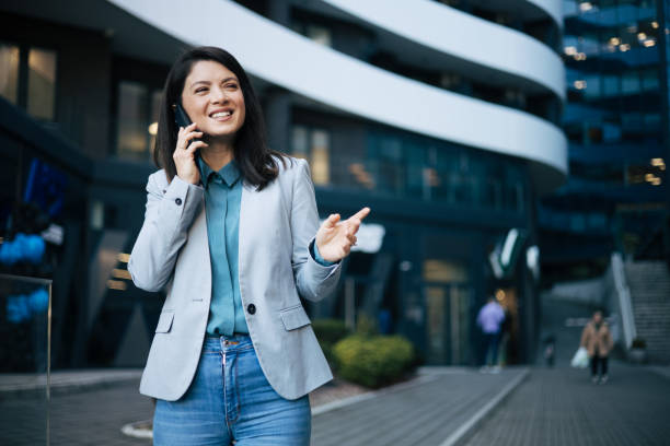 istock Young businesswoman talking on mobile phone 1889344889