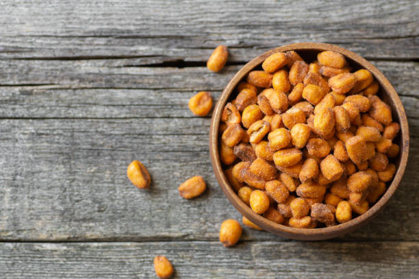 istock Roasted salted Corn Nuts with Spice and Sauce in bowl, Nut concept 1889346445