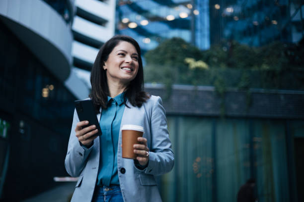 istock Young businesswoman using cell phone 1889349049