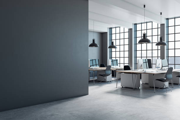 istock Modern coworking office interior with clean mock up place on wall, large panoramic windows with city view, lamps, concrete flooring and other objects. 3D Rendering. 1889352160
