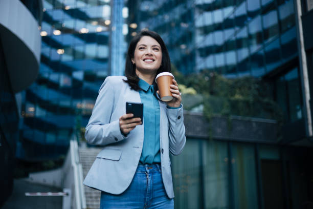 istock Young businesswoman using cell phone 1889356271