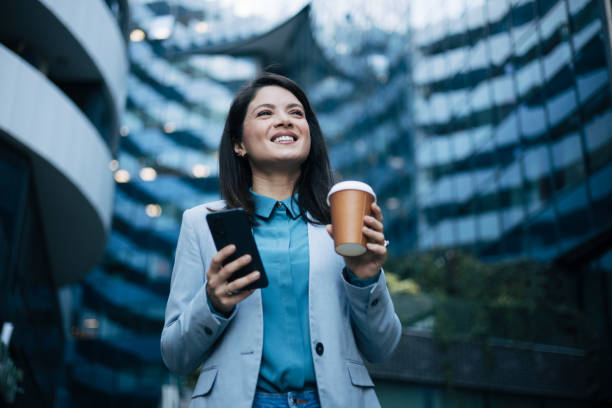 istock Young businesswoman using cell phone 1889357837