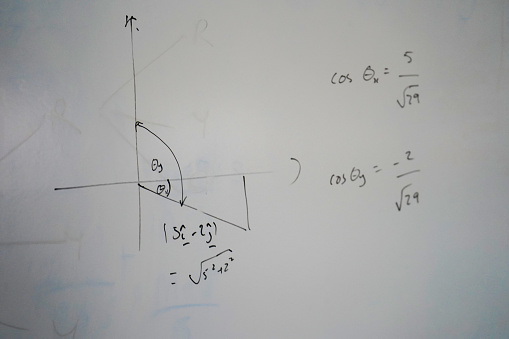 Close up of maths equations on a school whiteboard