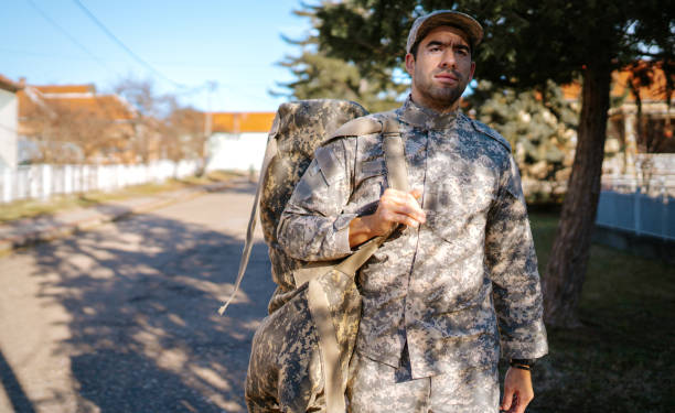istock Young handsome soldier on the move 1889367373