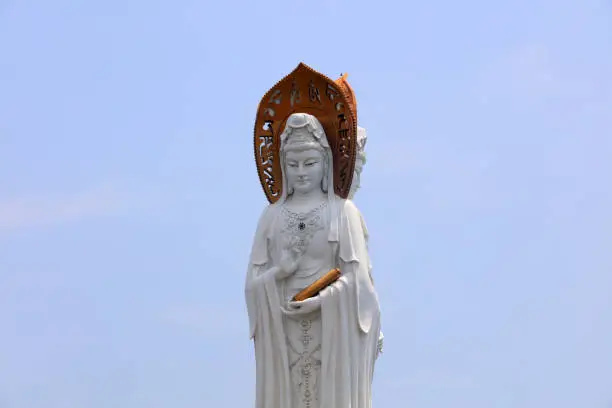 Sanya City, China - April 2, 2019: Guanyin sculpture on the sea in Nanshan tourist area, Sanya City, Hainan Province, China