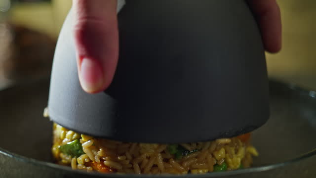 Chef plating fried rice