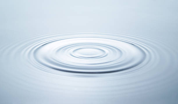 istock Blue water circles surface with rings and ripples from drop 1889410356