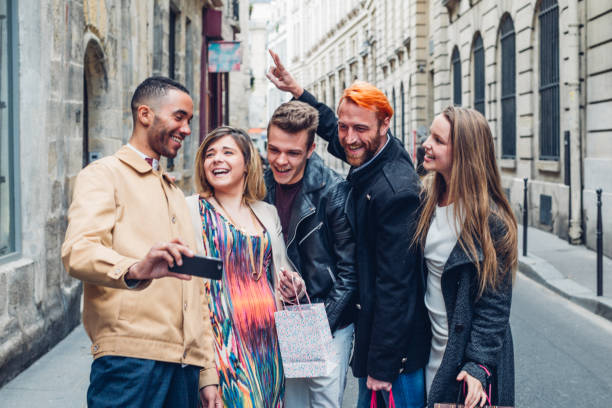 istock Group of friends visiting Paris and capturing memories using a smartphone camera 1889411422