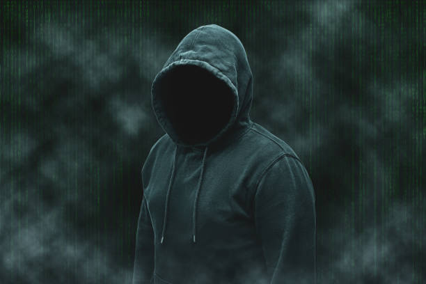 istock Mysterious faceless hooded anonymous computer hacker, silhouette of cybercriminal, terrorist 1889484800