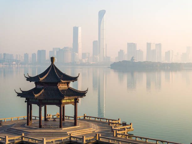 istock The calm lake surface and urban architecture 1889491090