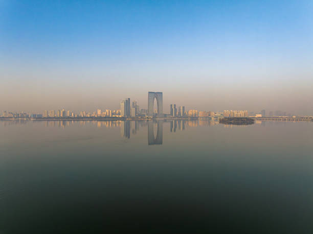 istock The calm lake surface and urban architecture 1889506735