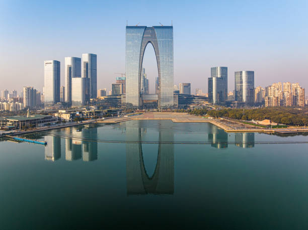 istock The calm lake surface and urban architecture 1889511420