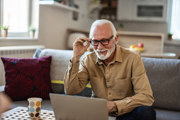 istock Shot of a senior businessman working from home while using his laptop. 1889511944