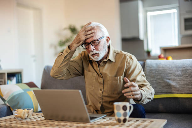 istock Man feeling frustrated while using his laptop. .Angry stressed business man using laptop mad about broken computer online problem annoyed with slow stuck laptop error, crazy about system virus or data loss, outraged with website mistake. 1889514055