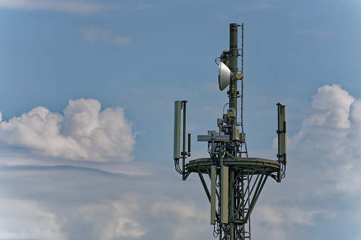 Close-up of an antenna mast with many different antennas for mobile communication, global network, data transfer.