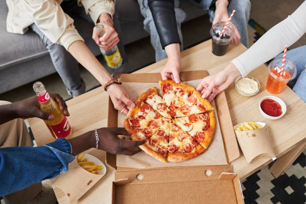 istock People Taking Pizza Slices at Party 1889561953