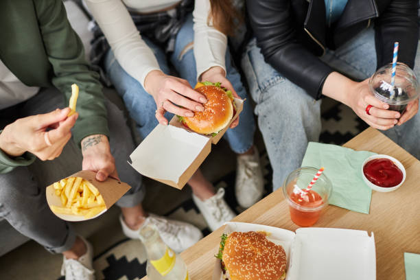 istock Friends Eating Fast Food 1889561986