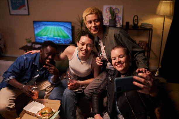 istock Students at Home Party with Fast Food Taking Selfie 1889562534