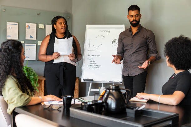 istock African American entrepreneur presenting with a whiteboard in a corporate room 1889571876