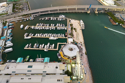 Miami Brickell bay harbor with many luxury yachts and sailboats. Docking place for water transport in Florida, USA.