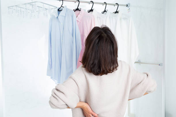 istock A woman hangs laundry in the bathroom. 1889700161