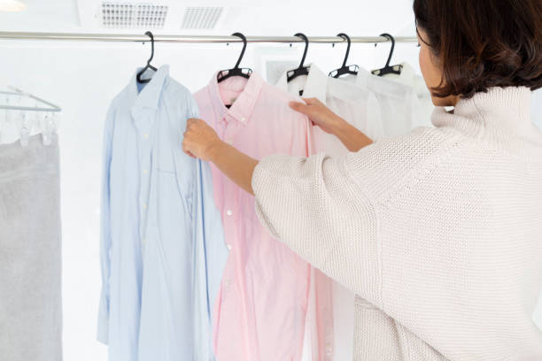 istock A woman hangs laundry in the bathroom. 1889701770