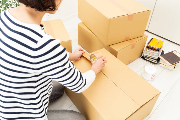 istock A woman preparing to move. 1889707671