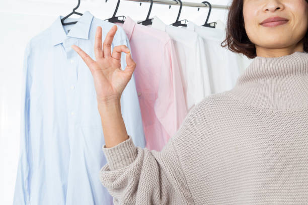 istock A woman hangs laundry in the bathroom. 1889708745