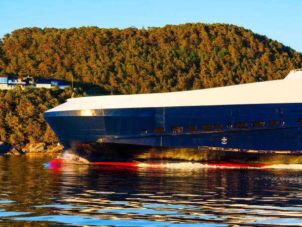 Fjord with ferry boat in Norway. Travel, cruising and vacation.