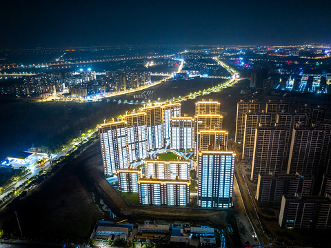 Aerial photography of high-rise apartment buildings in China, all lights are on at night