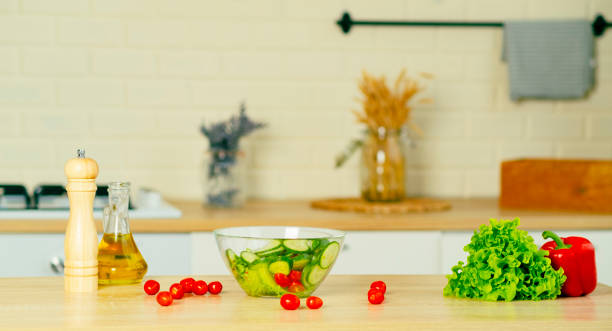 istock Transparent bowl with vegetable salad, fresh vegetables on table in kitchen. Food concept. Health food. 1889742844