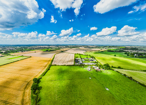 Aerial view of beautiful agricultural fields with cloud in England