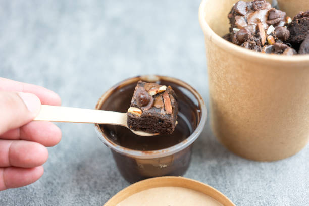 istock Delicious chocolate brownie doing dipping melted chocolate 1889773226