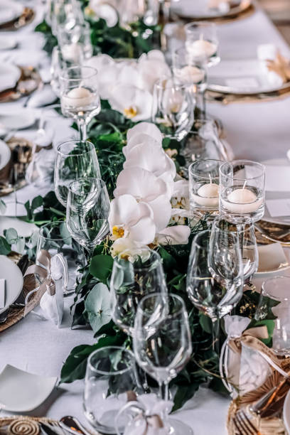 istock Wedding hall with white chairs, white tablecloths and wine glasses 1889775876