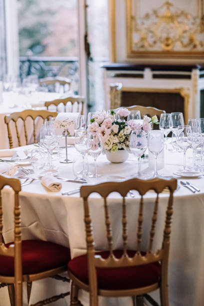 istock The ceremonial hall for the wedding. White tablecloths, flowers on the table 1889778044