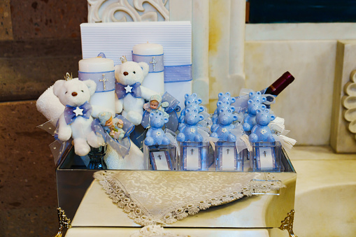 A set of gifts and accessories for the baptism of a boy. Christian traditions and rituals.