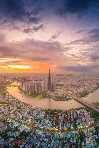 istock Aerial sunset view at Landmark 81 - it is a super tall skyscraper and Saigon bridge with development buildings along Saigon river 1889811563