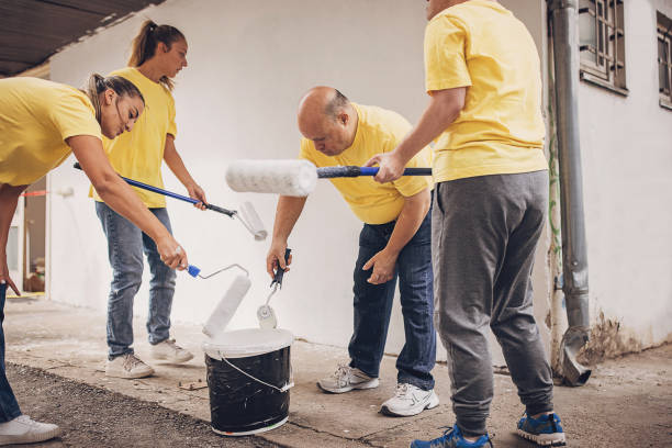 istock Volunteers renovating building together 1889815255