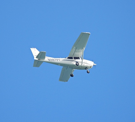 Boca Raton, Palm Beach County, Florida, USA, Dec. 23, 2023. A Cessna 172S fixed wing single engine (4 seats / 1 engine)\nN987PF taking off from the Boca Raton Airport.