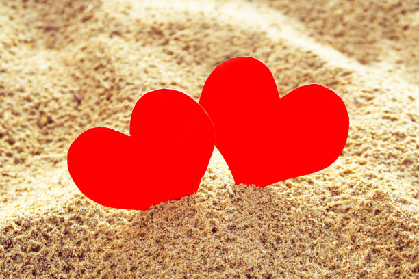 istock Hearts in the Sand closeup 1889896199