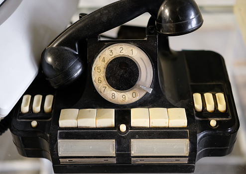 Yellow vintage telephone handset isolated on white background with copy space