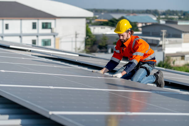 istock One of industrial technician worker hold the panel after install to maintenance solar cell panels on rooftop of factory building. Green and sustainable energy concept to good environment. 1889972152