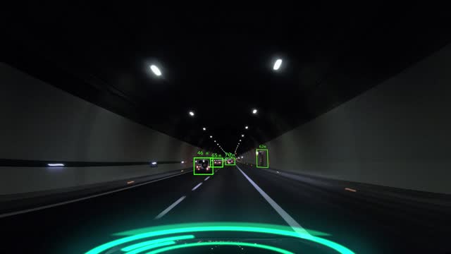 Autonomous system based on artificial intelligence drives the vehicle. Driverless car of the future drives through a tunnel, scanning the surrounding traffic.