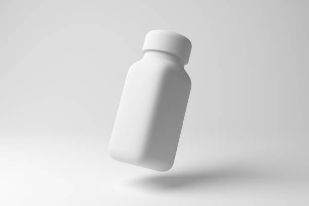 istock White small bottle floating in mid air on white background in monochrome and minimalism. Illustration of the concept of packaging and manufacturing 1890016143