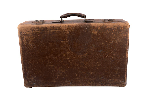 Old vintage suitcase isolated over white background.