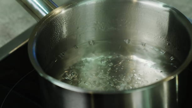 istock Boiling water on stainless saucepan on stove closeup 1890052938