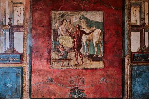 Naples, Italy - October 31 2023: Fresco and wall paintings in House of the Vettii or Casa dei Vettii or Domus Vettiorum in the archaeological site of Pompeii