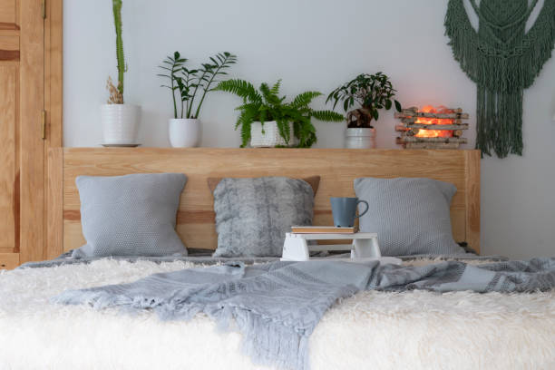 istock Architecture indoors. Boho bedroom with bed and pillows in a cottage. Home interior. 1890067417