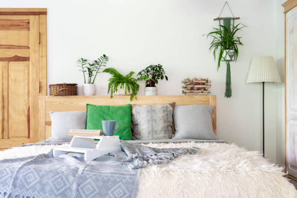 istock Architecture indoors. Boho bedroom with bed and pillows in a cottage. Home interior. 1890067933